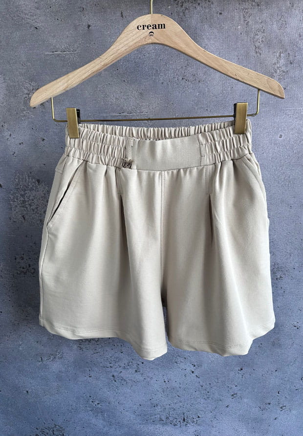 MEGI JASNO BEŻOWE SPODENKI / ZŁOTY ZNACZEK "M" / P1935 